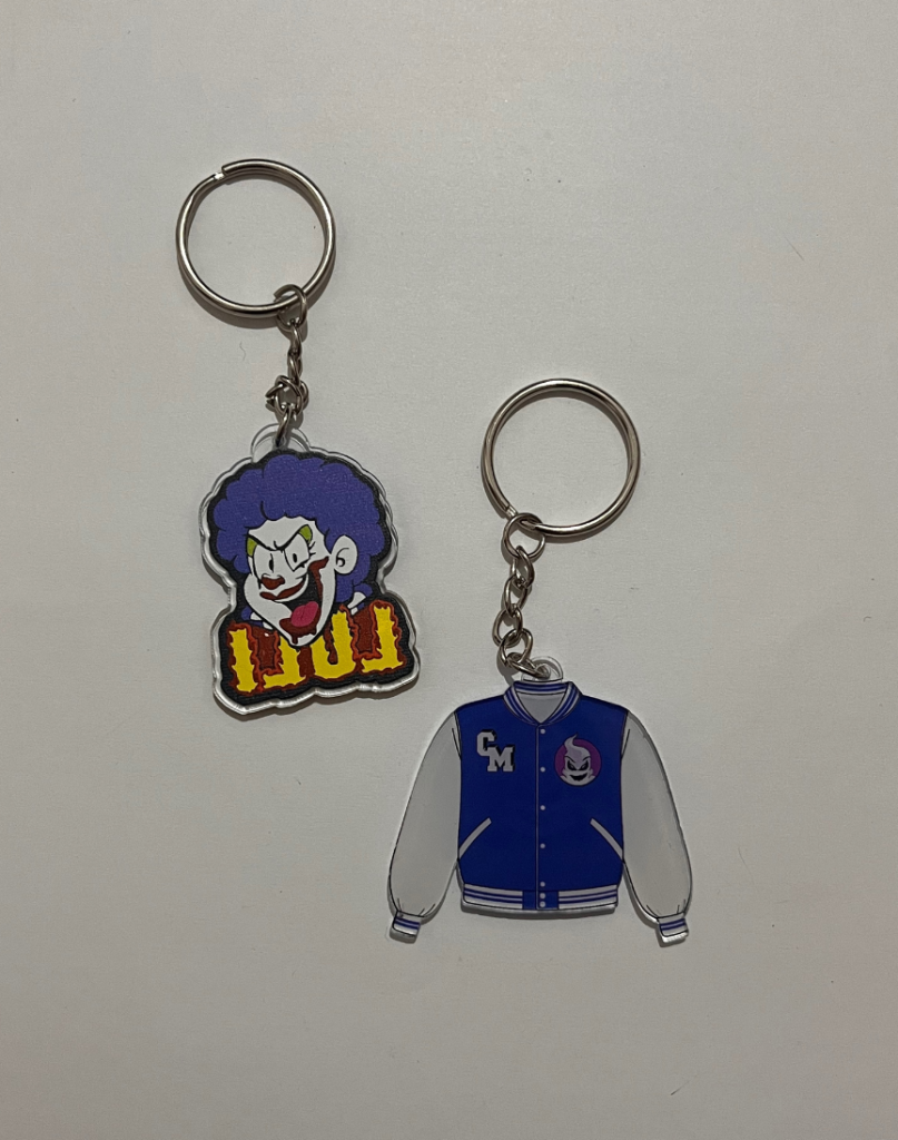 Merch oficial para evento — lanyards, llaveros y accesorios